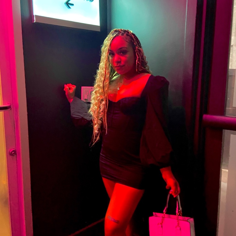 Sweet heart long sleeve black dress.